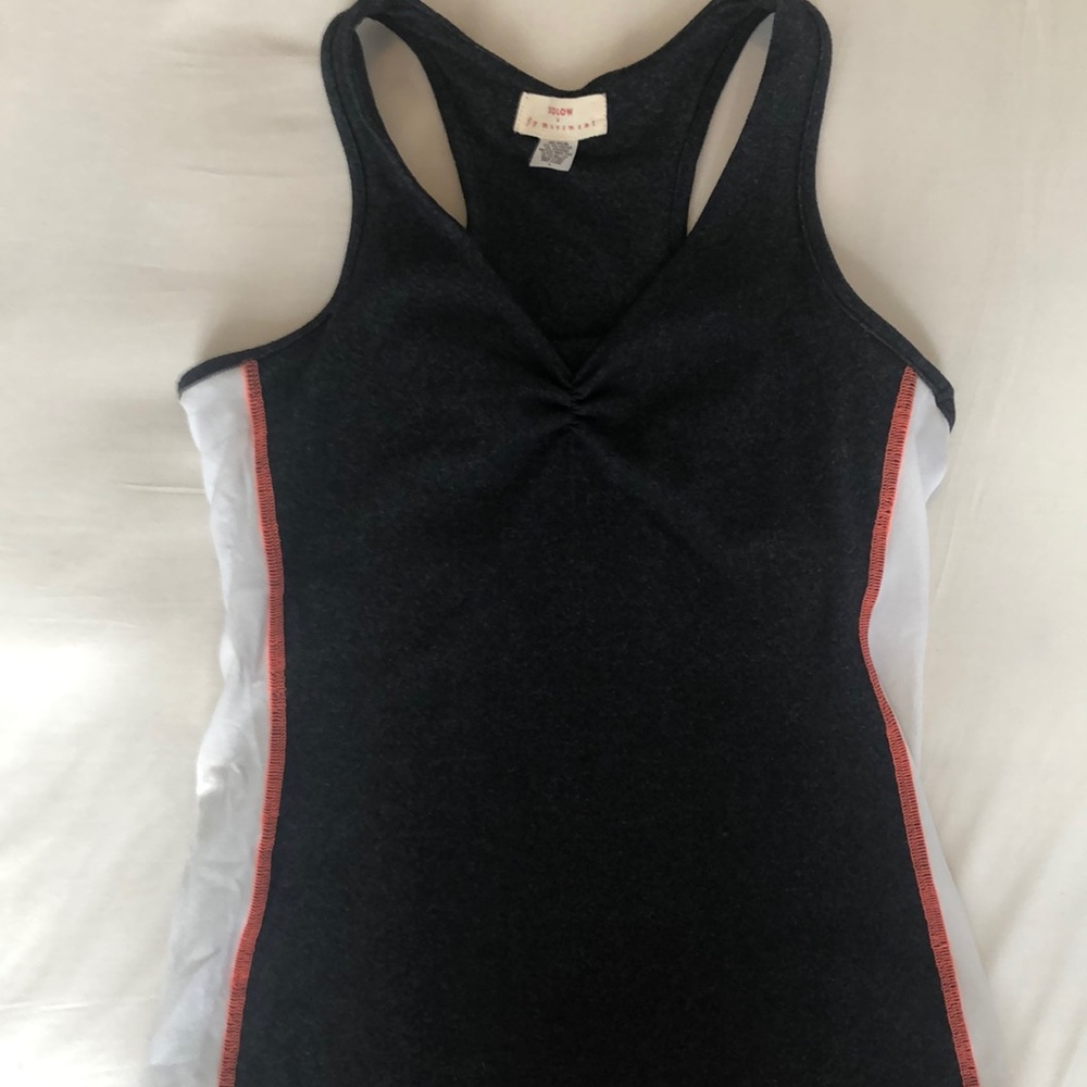 Stretchy Solow racerback with reflective logo.